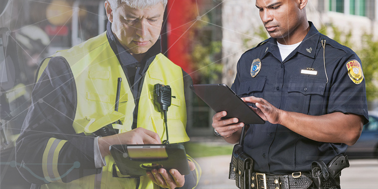  A healthcare worker and policeman using tablets that are managed and secured by SOTI ONE Platform